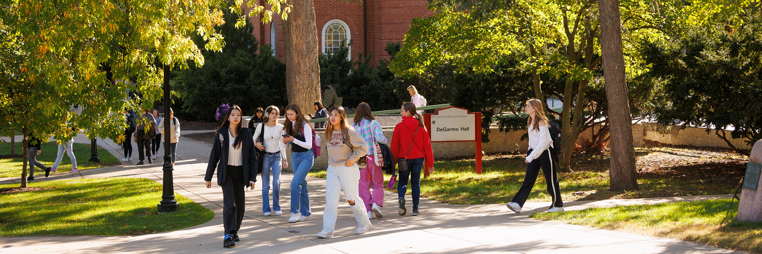 Students walking in front of the DeGarmo Hall building.