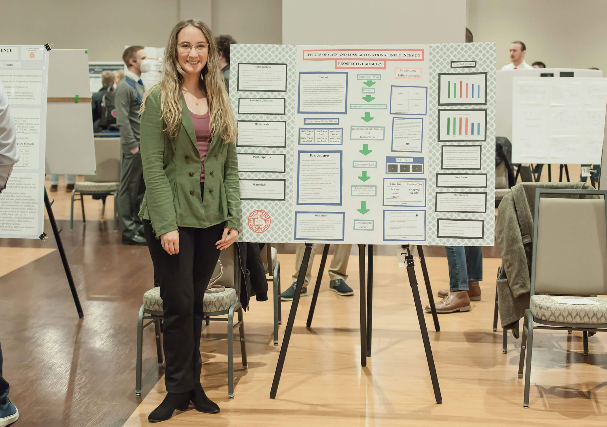 A student displaying their research poster.