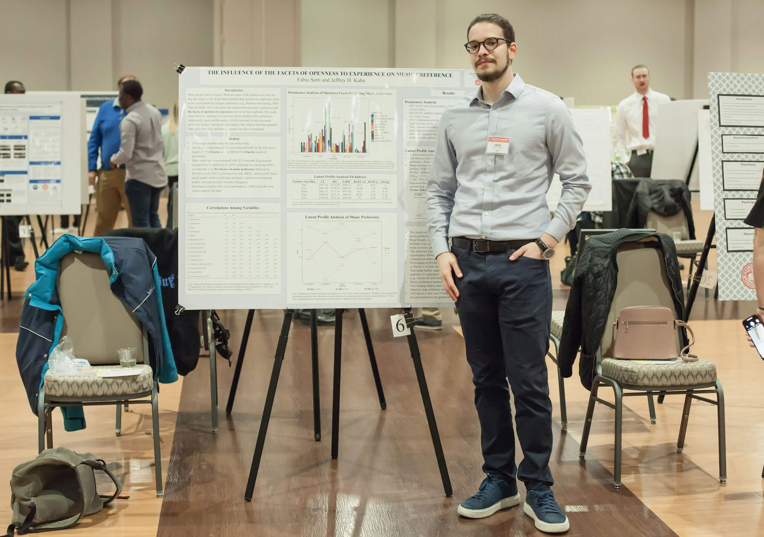 A student displaying their research poster.